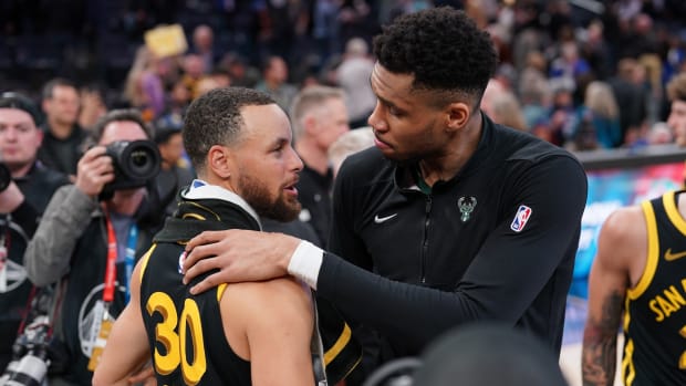 Milwaukee Bucks forward Giannis Antetokounmpo (34) and Golden State Warriors guard Stephen Curry (30)